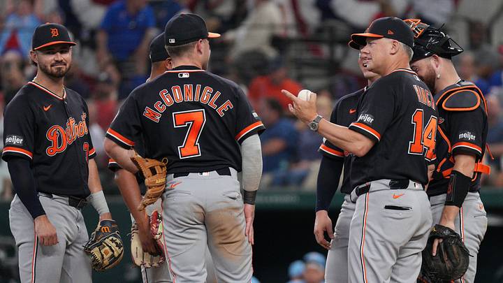 Detroit Tigers manager A.J. Hinch (14) talks with his infield on the mound during a pitching change. Detroit Tigers manager A.J. Hinch (14) talks with his infield on the mound during a pitching change.