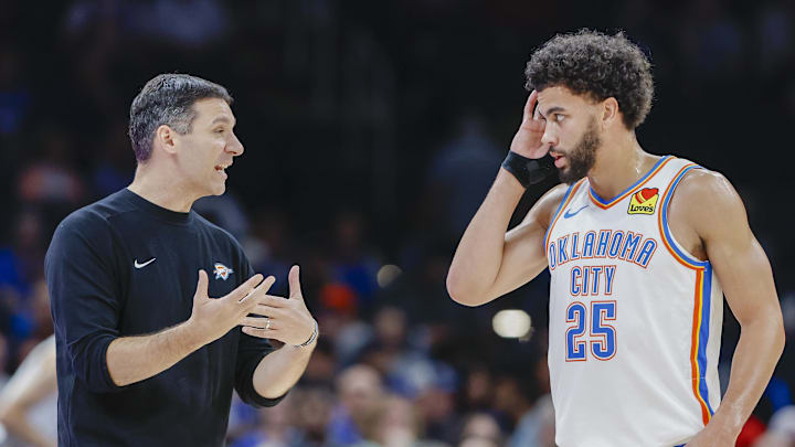 Oct 9, 2024; Oklahoma City, Oklahoma, USA; Oklahoma City Thunder head coach Mark Daigneault talks to guard Ajay Mitchell (25) during a break in play in the second half at Paycom Center. Mandatory Credit: Alonzo Adams-Imagn Images