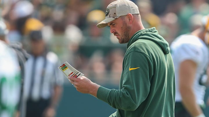 Green Bay Packers quarterbacks coach Sean Mannion reviews his practice schedule during practice on Friday, August 1, 2025, at Ray Nitschke Field in Ashwaubenon, Wis. Green Bay Packers quarterbacks coach Sean Mannion reviews his practice schedule during practice on Friday, August 1, 2025, at Ray Nitschke Field in Ashwaubenon, Wis.