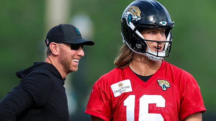 Aug 2, 2026; Jacksonville, FL, USA; Jacksonville Jaguars head coach Liam Coen talks to quarterback Trevor Lawrence (16) during training camp at Miller Electric Center. Mandatory Credit: Nathan Ray Seebeck-Imagn Images