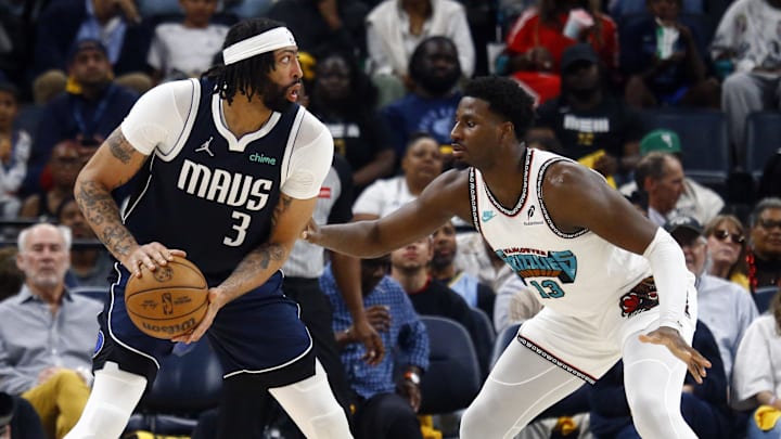 Apr 18, 2025; Memphis, Tennessee, USA; Dallas Mavericks forward Anthony Davis (3) handles the ball against Memphis Grizzlies forward Jaren Jackson Jr. (13) during the third quarter at FedExForum. Mandatory Credit: Petre Thomas-Imagn Images Apr 18, 2025; Memphis, Tennessee, USA; Dallas Mavericks forward Anthony Davis (3) handles the ball against Memphis Grizzlies forward Jaren Jackson Jr. (13) during the third quarter at FedExForum. Mandatory Credit: Petre Thomas-Imagn Images