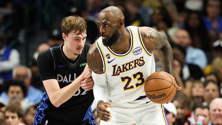 Apr 5, 2026; Dallas, Texas, USA;  Los Angeles Lakers forward LeBron James (23) controls the ball as  Dallas Mavericks forward Cooper Flagg (32) defends during the first half at American Airlines Center. Mandatory Credit: Kevin Jairaj-Imagn Images