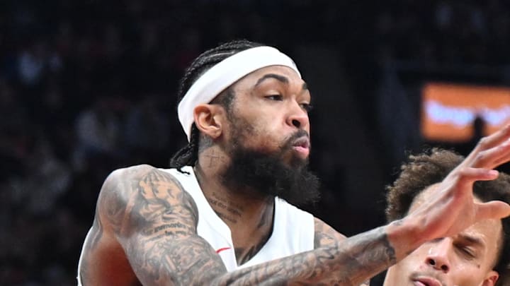 Toronto Raptors forward Brandon Ingram passes the ball as he collides with Atlanta Hawks guard Dyson Daniels. Toronto Raptors forward Brandon Ingram passes the ball as he collides with Atlanta Hawks guard Dyson Daniels.