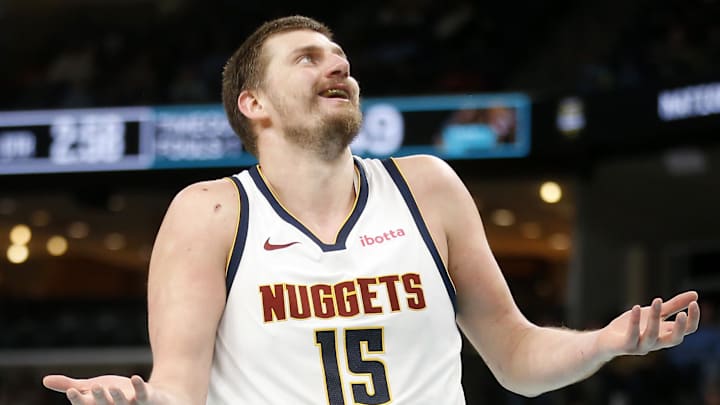Mar 18, 2026; Memphis, Tennessee, USA; Denver Nuggets center Nikola Jokic (15) reacts during the second quarter against the Memphis Grizzlies at FedExForum. Mandatory Credit: Petre Thomas-Imagn Images Mar 18, 2026; Memphis, Tennessee, USA; Denver Nuggets center Nikola Jokic (15) reacts during the second quarter against the Memphis Grizzlies at FedExForum. Mandatory Credit: Petre Thomas-Imagn Images