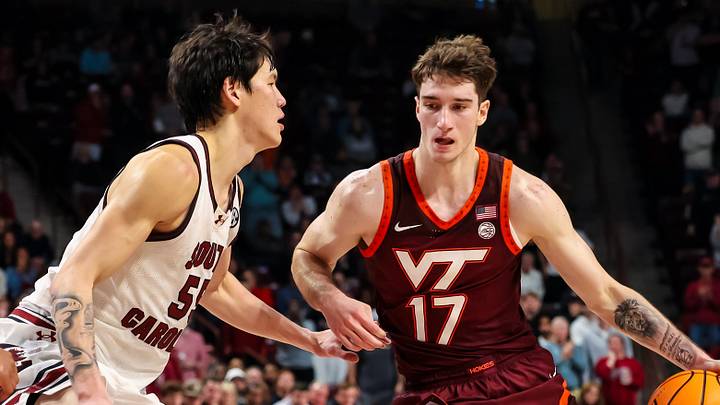 Dec 2, 2025; Columbia, South Carolina, USA; Virginia Tech Hokies guard Neoklis Avdalas (17) drives around South Carolina Gamecocks guard Mike Sharavjamts (55) in the second half at Colonial Life Arena. Mandatory Credit: Jeff Blake-Imagn Images Dec 2, 2025; Columbia, South Carolina, USA; Virginia Tech Hokies guard Neoklis Avdalas (17) drives around South Carolina Gamecocks guard Mike Sharavjamts (55) in the second half at Colonial Life Arena. Mandatory Credit: Jeff Blake-Imagn Images