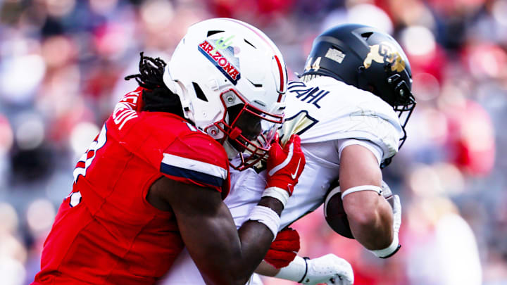 Oct 19, 2024; Tucson, Arizona, USA; Arizona Wildcats defensive lineman Chase Kennedy (11) tackles Colorado Buffaloes during the fourth quarter at Arizona Stadium. Mandatory Credit: Aryanna Frank-Imagn Images Oct 19, 2024; Tucson, Arizona, USA; Arizona Wildcats defensive lineman Chase Kennedy (11) tackles Colorado Buffaloes during the fourth quarter at Arizona Stadium. Mandatory Credit: Aryanna Frank-Imagn Images