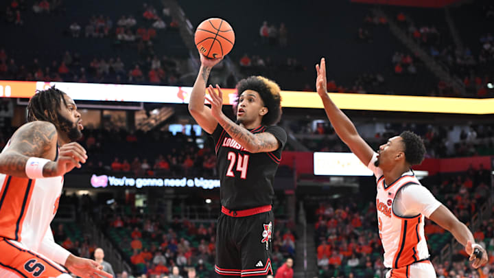Jan 14, 2025; Syracuse, New York, USA; Louisville Cardinals guard Chucky Hepburn (24) shoots the ball between Syracuse Orange guard J.J. Starling (2) and center Eddie Lampkin Jr. (44) in the first half at the JMA Wireless Dome. Jan 14, 2025; Syracuse, New York, USA; Louisville Cardinals guard Chucky Hepburn (24) shoots the ball between Syracuse Orange guard J.J. Starling (2) and center Eddie Lampkin Jr. (44) in the first half at the JMA Wireless Dome.
