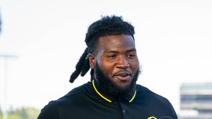 Oregon Ducks' Bear Alexander at football media day with reporter Bri Amaranthus 