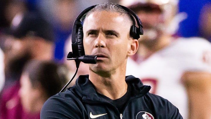 Florida State Seminoles head coach Mike Norvell looks to the replay screen at Steve Spurrier Field at Ben Hill Griffin Stadium in Gainesville, FL on Saturday, November 25, 2023 during the first half. [Doug Engle/Gainesville Sun]