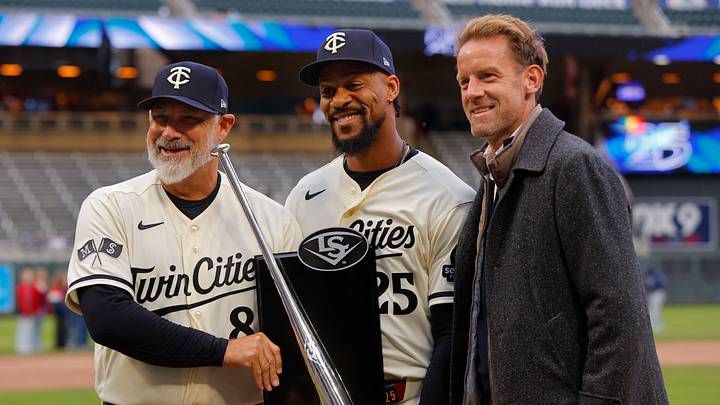 Apr 4, 2026; Minneapolis, Minnesota, USA; Minnesota Twins designated hitter Byron Buxton (25) displays his 2025 silver slugger award with manager Derek Shelton and owner Tom Pohlad before the game with the Tampa Bay Rays at Target Field. Mandatory Credit: Bruce Kluckhohn-Imagn Images