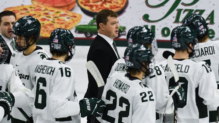 MSU hockey coach Adam Nightingale and his Spartans gather on the ice following MSU's 4-3 win over Notre Dame, Saturday, Nov. 15, 2024.
