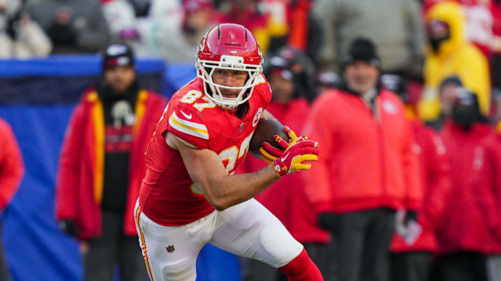 Dec 14, 2025; Kansas City, Missouri, USA; Kansas City Chiefs tight end Travis Kelce (87) runs with the ball during the second half against the Los Angeles Chargers at GEHA Field at Arrowhead Stadium. Mandatory Credit: Jay Biggerstaff-Imagn Images Dec 14, 2025; Kansas City, Missouri, USA; Kansas City Chiefs tight end Travis Kelce (87) runs with the ball during the second half against the Los Angeles Chargers at GEHA Field at Arrowhead Stadium. Mandatory Credit: Jay Biggerstaff-Imagn Images