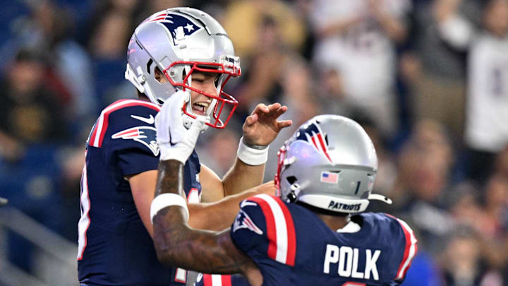 Aug 15, 2024; Foxborough, Massachusetts, USA; New England Patriots quarterback Drake Maye (10) celebrates with wide receiver Ja'Lynn Polk (1) after scoring a touchdown against the Philadelphia Eagles during the first half at Gillette Stadium. Mandatory Credit: Brian Fluharty-USA TODAY Sports