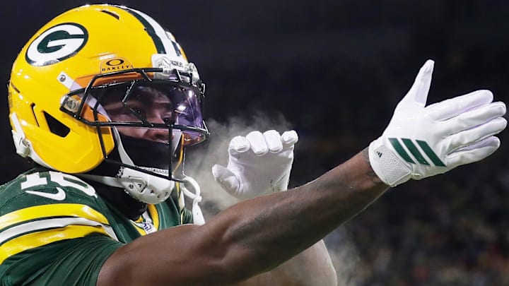 Green Bay Packers cornerback Bo Melton (16) celebrates a touchdown catch at the Bears.