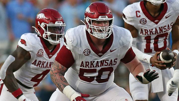 Arkansas Razorback offensive lineman Kobe Branham (50) blocks during the second quarter against the Mississippi Rebels at Vaught-Hemingway Stadium. Arkansas Razorback offensive lineman Kobe Branham (50) blocks during the second quarter against the Mississippi Rebels at Vaught-Hemingway Stadium.