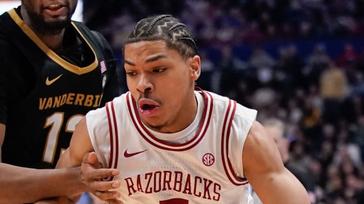 Arkansas guard Darius Acuff Jr. (5) gets past Vanderbilt forward Jalen Washington (13) during the second half of the SEC tournament championship game at Bridgestone Arena in Nashville, Tenn., Sunday, March 15, 2026. Arkansas guard Darius Acuff Jr. (5) gets past Vanderbilt forward Jalen Washington (13) during the second half of the SEC tournament championship game at Bridgestone Arena in Nashville, Tenn., Sunday, March 15, 2026.