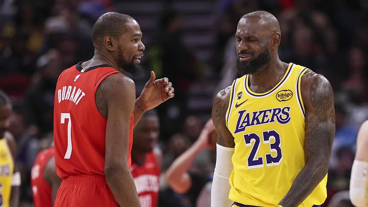 Mar 16, 2026; Houston, Texas, USA; Houston Rockets forward Kevin Durant (7) talks with Los Angeles Lakers forward LeBron James (23) on the court during the second quarter at Toyota Center. Mandatory Credit: Troy Taormina-Imagn Images