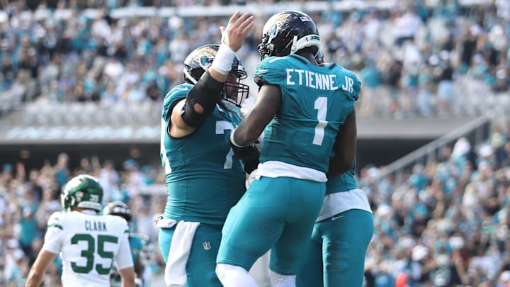 Dec 14, 2025; Jacksonville, Florida, USA; Jacksonville Jaguars running back Travis Etienne Jr. (1) reacts after scoring a touchdown during the second quarter against the New York Jets at EverBank Stadium. Mandatory Credit: Morgan Tencza-Imagn Images Dec 14, 2025; Jacksonville, Florida, USA; Jacksonville Jaguars running back Travis Etienne Jr. (1) reacts after scoring a touchdown during the second quarter against the New York Jets at EverBank Stadium. Mandatory Credit: Morgan Tencza-Imagn Images