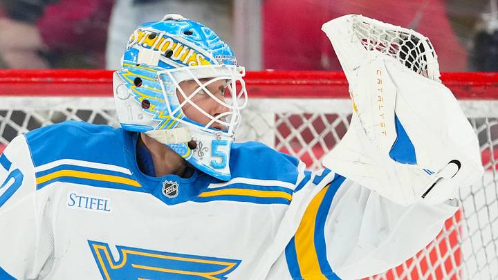 Mar 12, 2026; Raleigh, North Carolina, USA;  St. Louis Blues goaltender Jordan Binnington (50) looks at the puck in his glove during the warmups before the game against the Carolina Hurricanes at Lenovo Center. Mandatory Credit: James Guillory-Imagn Images