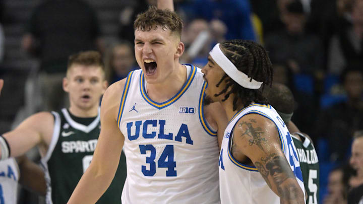 Feb 4, 2025; Los Angeles, California, USA; UCLA Bruins guard Skyy Clark (55) and forward Tyler Bilodeau (34) celebrate after a basket during the second half against the Michigan State Spartans at Pauley Pavilion presented by Wescom. Mandatory Credit: Jayne Kamin-Oncea-Imagn Images