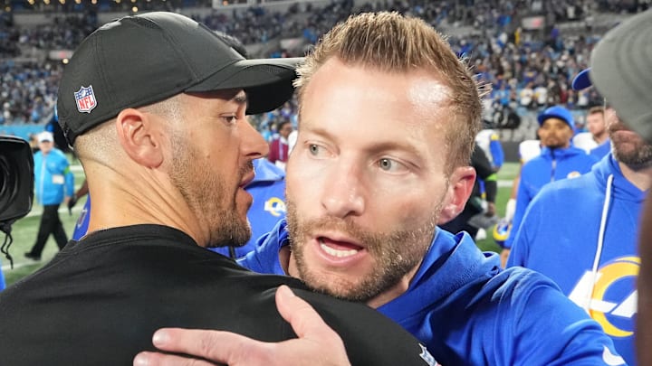 Jan 10, 2026; Charlotte, NC, USA; Los Angeles Rams head coach Sean McVay and Carolina Panthers head coach Dave Canales meet after the game in the NFC Wild Card Round game at Bank of America Stadium. Mandatory Credit: Bob Donnan-Imagn Images