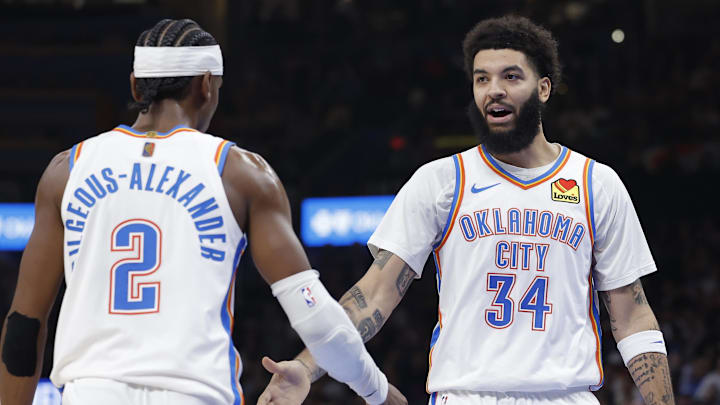 Jan 7, 2026; Oklahoma City, Oklahoma, USA; Oklahoma City Thunder guard/forward Kenrich Williams (34) and Oklahoma City Thunder guard Shai Gilgeous-Alexander (2) celebrate after a play against the Utah Jazz during the second half at Paycom Center. Mandatory Credit: Alonzo Adams-Imagn Images