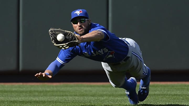 Toronto Blue Jays center fielder Kevin Pillar (11) makes a diving catch. Toronto Blue Jays center fielder Kevin Pillar (11) makes a diving catch.