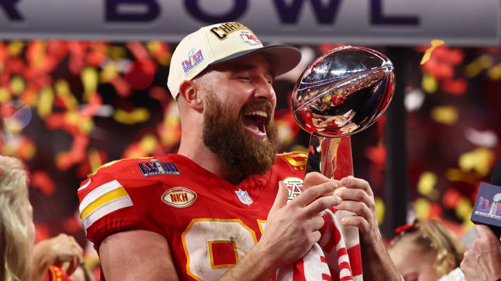 Feb 11, 2024; Paradise, Nevada, USA; Kansas City Chiefs tight end Travis Kelce (87) celebrates with the Lombardi Trophy.