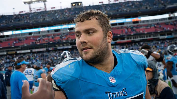 Tennessee offensive tackle Peter Skoronski (77) visits with his Los Angeles Chargers opponents after during their game at Nissan Stadium in Nashville, Tenn., Sunday, Nov. 2, 2025. Tennessee offensive tackle Peter Skoronski (77) visits with his Los Angeles Chargers opponents after during their game at Nissan Stadium in Nashville, Tenn., Sunday, Nov. 2, 2025.