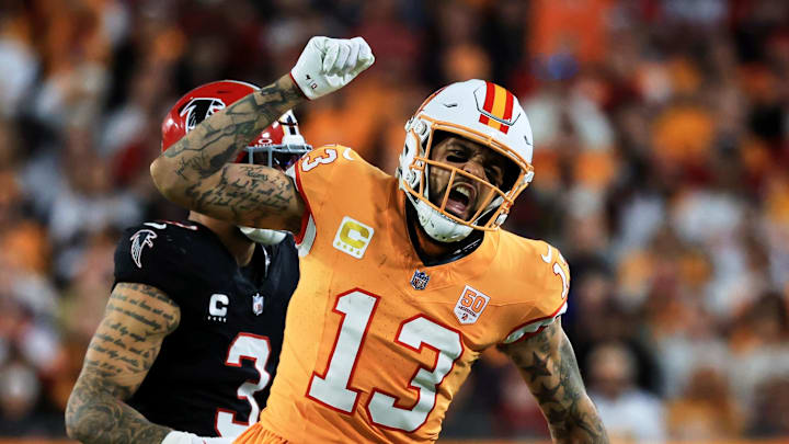 Tampa Bay Buccaneers wide receiver Mike Evans (13) reacts after catching a pass against Atlanta Falcons safety Jessie Bates III Tampa Bay Buccaneers wide receiver Mike Evans (13) reacts after catching a pass against Atlanta Falcons safety Jessie Bates III