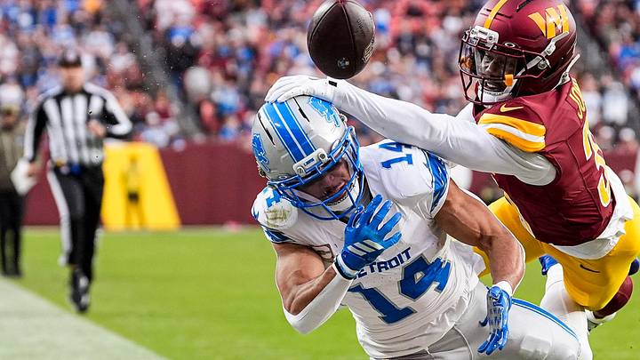Washington Commanders CB Jonathan Jones (31) blocks a pass intended for Detroit Lions wide receiver Amon-Ra St. Brown