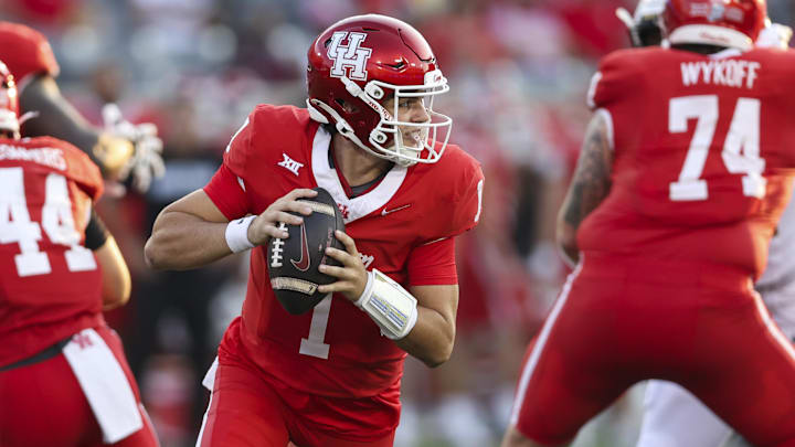 Sep 12, 2025; Houston, Texas, USA; Houston Cougars quarterback Conner Weigman (1) runs with the ball during the first quarter against the Colorado Buffaloes at TDECU Stadium. Mandatory Credit: Troy Taormina-Imagn Images