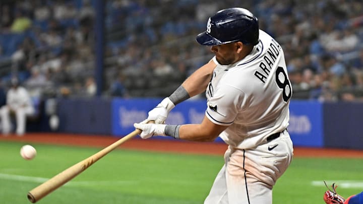 Apr 7, 2026; St. Petersburg, Florida, USA; Tampa Bay Rays first baseman Jonathan Aranda (62) hits a RBI double in the eighth  inning against the Chicago Cubs at Tropicana Field. 