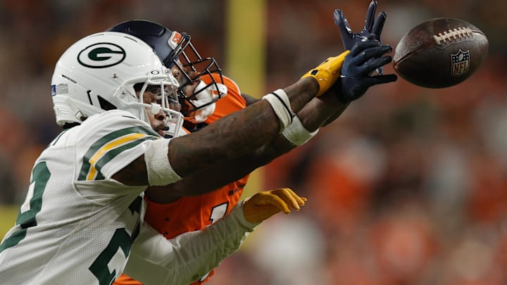Green Bay Packers safety Xavier McKinney (29) deflects a pass intended for Denver Broncos wide receiver Courtland Sutton.