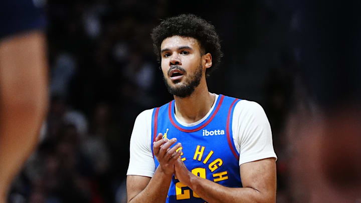 Mar 11, 2026; Denver, Colorado, USA; Denver Nuggets forward Cameron Johnson (23) reacts in the third quarter against the Houston Rockets at Ball Arena.