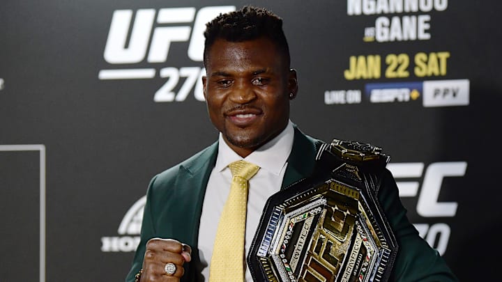 Jan 22, 2022; Anaheim, California, USA; Francis Ngannou poses for photos following his championship victory at UFC 270 at Honda Center. Mandatory Credit: Gary A. Vasquez-Imagn Images