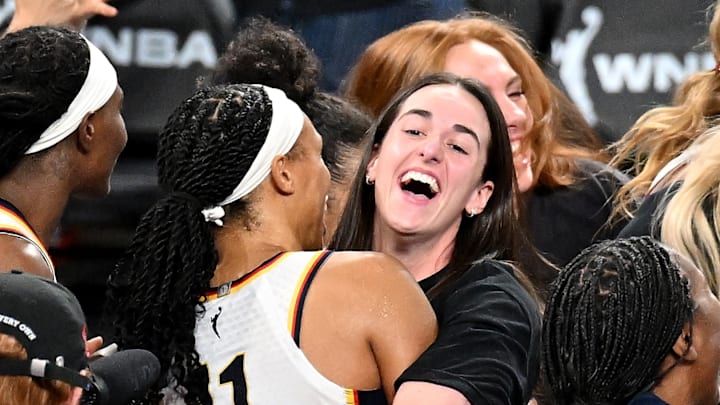 Fever guard Caitlin Clark cheered her teammates on in the WNBA playoffs from the bench.