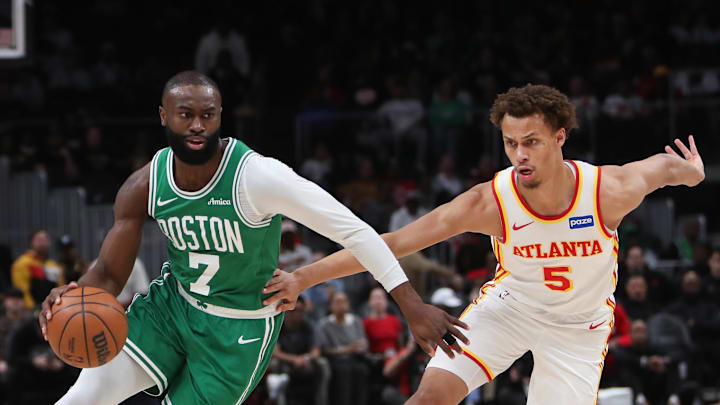 Mar 30, 2026; Atlanta, Georgia, USA; Boston Celtics guard Jaylen Brown (7) dribbles against Atlanta Hawks guard Dyson Daniels (5) in the first half at State Farm Arena. Mandatory Credit: Mady Mertens-Imagn Images