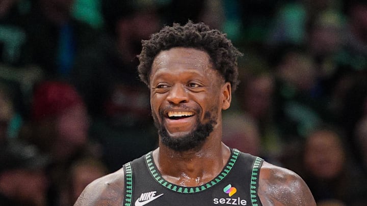 Feb 9, 2026; Minneapolis, Minnesota, USA; Minnesota Timberwolves forward Julius Randle (30) and guard Anthony Edwards (5) laugh after a timeout against the Atlanta Hawks in the fourth quarter at Target Center. Mandatory Credit: Brad Rempel-Imagn Images