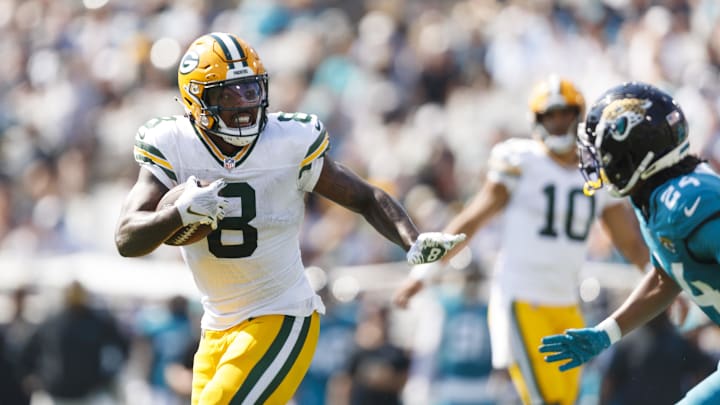 Green Bay Packers running back Josh Jacobs (8) runs the ball against the Jacksonville Jaguars during the second quarter. Green Bay Packers running back Josh Jacobs (8) runs the ball against the Jacksonville Jaguars during the second quarter.
