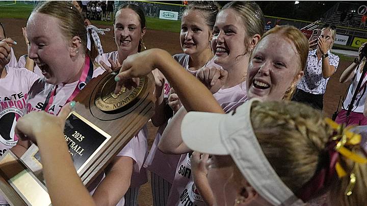 Clarksville softball team celebrates with trophy after winning 4-0 over Wayne in the 1A state softball championship game at Roger Sports Complex on July 25, 2025, in Fort Dodge, Iowa. Clarksville softball team celebrates with trophy after winning 4-0 over Wayne in the 1A state softball championship game at Roger Sports Complex on July 25, 2025, in Fort Dodge, Iowa.