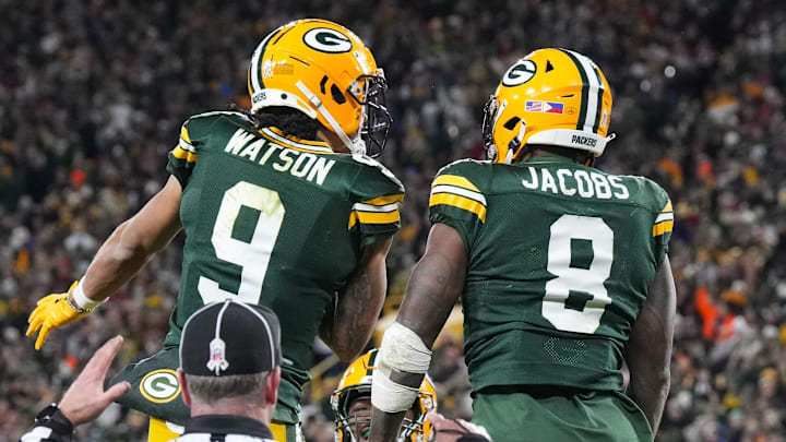 Green Bay Packers running back Josh Jacobs (8) celebrates with wide receiver Christian Watson after a touchdown last season.