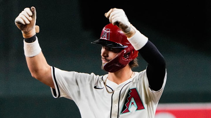 Sep 2, 2025; Phoenix, Arizona, USA; Arizona Diamondbacks shortstop Blaze Alexander (9) celebrates his single that brought home Arizona Diamondbacks outfielder Corbin Carroll (7) in the sixth inning of the game between Arizona Diamondbacks and Texas Rangers at Chase Field. Mandatory Credit: Arianna Grainey-Imagn Images