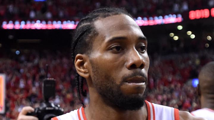 Toronto Raptors forward Kawhi Leonard claps his hands as he celebrates a win over the Milwaukee Bucks.