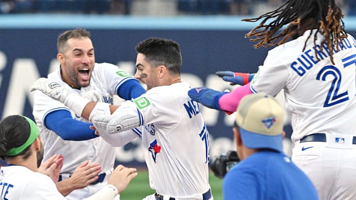 Sep 16, 2023; Toronto, Ontario, CAN; Toronto Blue Jays left fielder Whit Merrifield (15) celebrates with teammates after driving in the winning run against the Boston Red Sox in the 13th inning at Rogers Centre. Sep 16, 2023; Toronto, Ontario, CAN; Toronto Blue Jays left fielder Whit Merrifield (15) celebrates with teammates after driving in the winning run against the Boston Red Sox in the 13th inning at Rogers Centre.