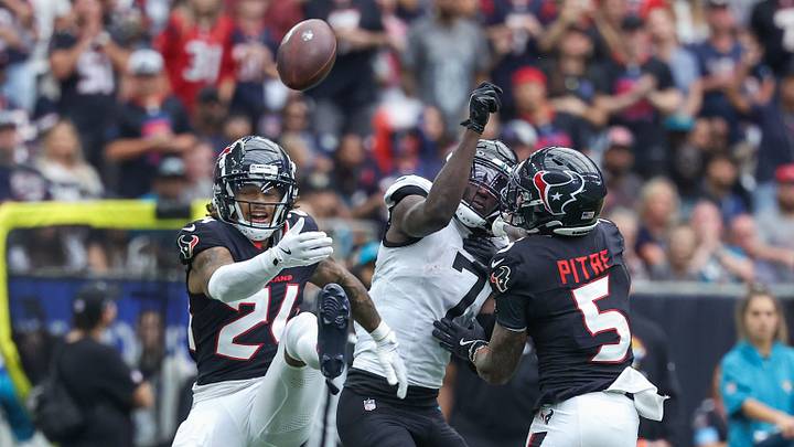 Sep 29, 2024; Houston, Texas, USA; Houston Texans cornerback Derek Stingley Jr. (24) and Houston Texans safety Jalen Pitre (5) attempt to break up a pass intended for Jacksonville Jaguars wide receiver Brian Thomas Jr. (7) during the fourth quarter at NRG Stadium. Mandatory Credit: Troy Taormina-Imagn Images Sep 29, 2024; Houston, Texas, USA; Houston Texans cornerback Derek Stingley Jr. (24) and Houston Texans safety Jalen Pitre (5) attempt to break up a pass intended for Jacksonville Jaguars wide receiver Brian Thomas Jr. (7) during the fourth quarter at NRG Stadium. Mandatory Credit: Troy Taormina-Imagn Images