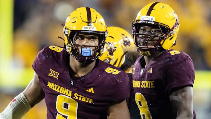 Nov 28, 2025; Tempe, Arizona, USA; Arizona State Sun Devils defensive lineman Elijah O'Neal (9) and linebacker Jordan Crook (8) against the Arizona Wildcats during the 99th Territorial Cup at Mountain America Stadium. Mandatory Credit: Mark J. Rebilas-Imagn Images Nov 28, 2025; Tempe, Arizona, USA; Arizona State Sun Devils defensive lineman Elijah O'Neal (9) and linebacker Jordan Crook (8) against the Arizona Wildcats during the 99th Territorial Cup at Mountain America Stadium. Mandatory Credit: Mark J. Rebilas-Imagn Images