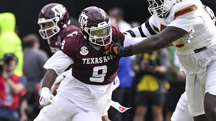 Dec 20, 2025; College Station, TX, USA; Texas A&M Aggies defensive end Cashius Howell (9) rushes the line past Miami Hurricanes offensive lineman Markel Bell (70) during the game between the Aggies and the Hurricanes at Kyle Field. Mandatory Credit: Jerome Miron-Imagn Images