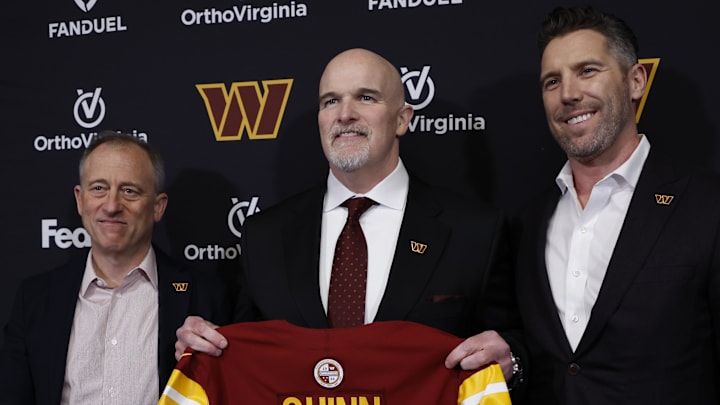 Feb 5, 2024; Ashburn, VA, USA; Washington Commanders head coach Dan Quinn (M) poses for a picture with Commanders managing partner Josh Harris (L) and Washington Commanders general manager Adam Peters (R) at an introductory press conference at Commanders Park. Mandatory Credit: Geoff Burke-Imagn Images
