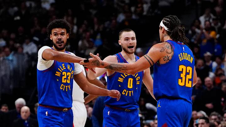 Mar 11, 2026; Denver, Colorado, USA; Denver Nuggets forward Cameron Johnson (23), guard Christian Braun (0) and forward Aaron Gordon (32) reacts in the third quarter against the Houston Rockets at Ball Arena. Mandatory Credit: Ron Chenoy-Imagn Images
